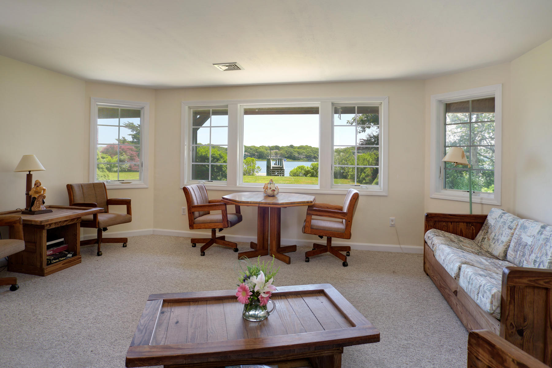 256 Monomoscoy Road Mashpee, MA 02649 - Photo 17 of 28 a living room with furniture and a window