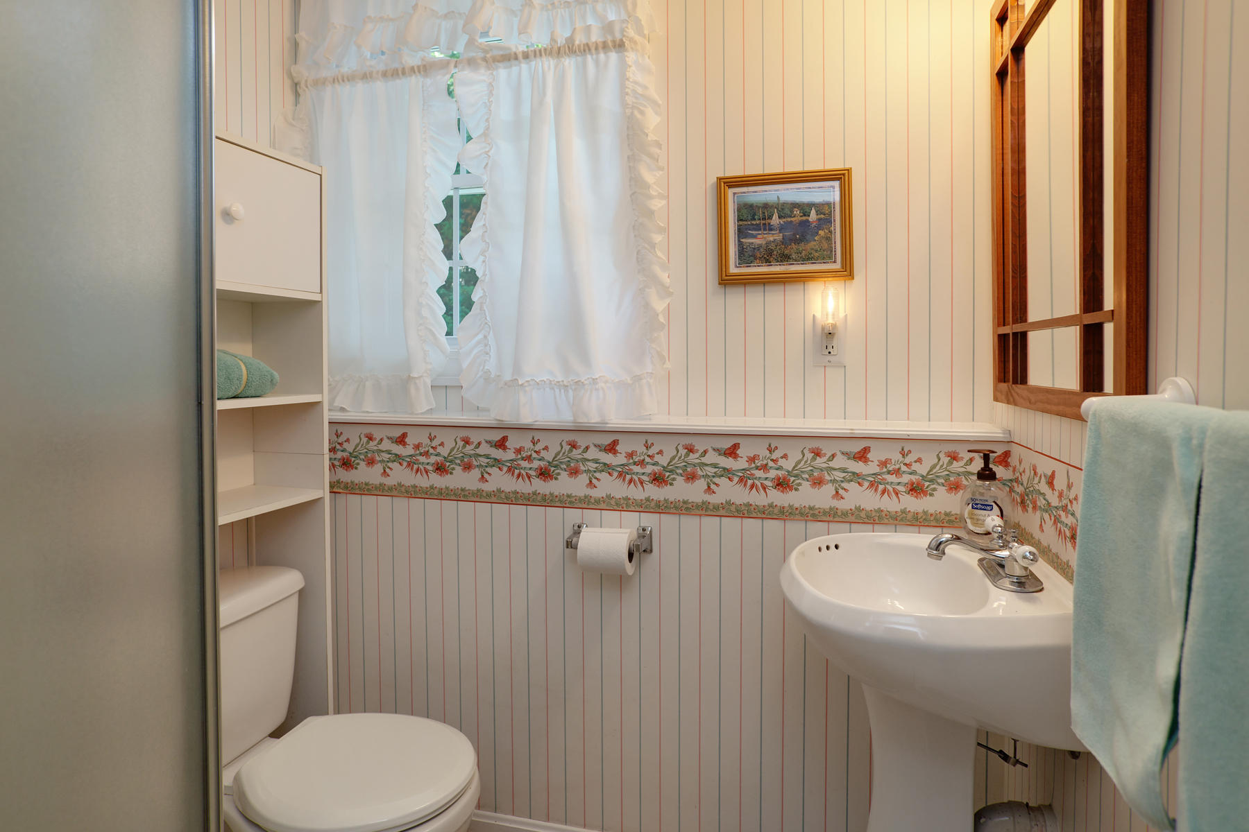 256 Monomoscoy Road Mashpee, MA 02649 - Photo 20 of 28 a bathroom with a sink a toilet and mirror