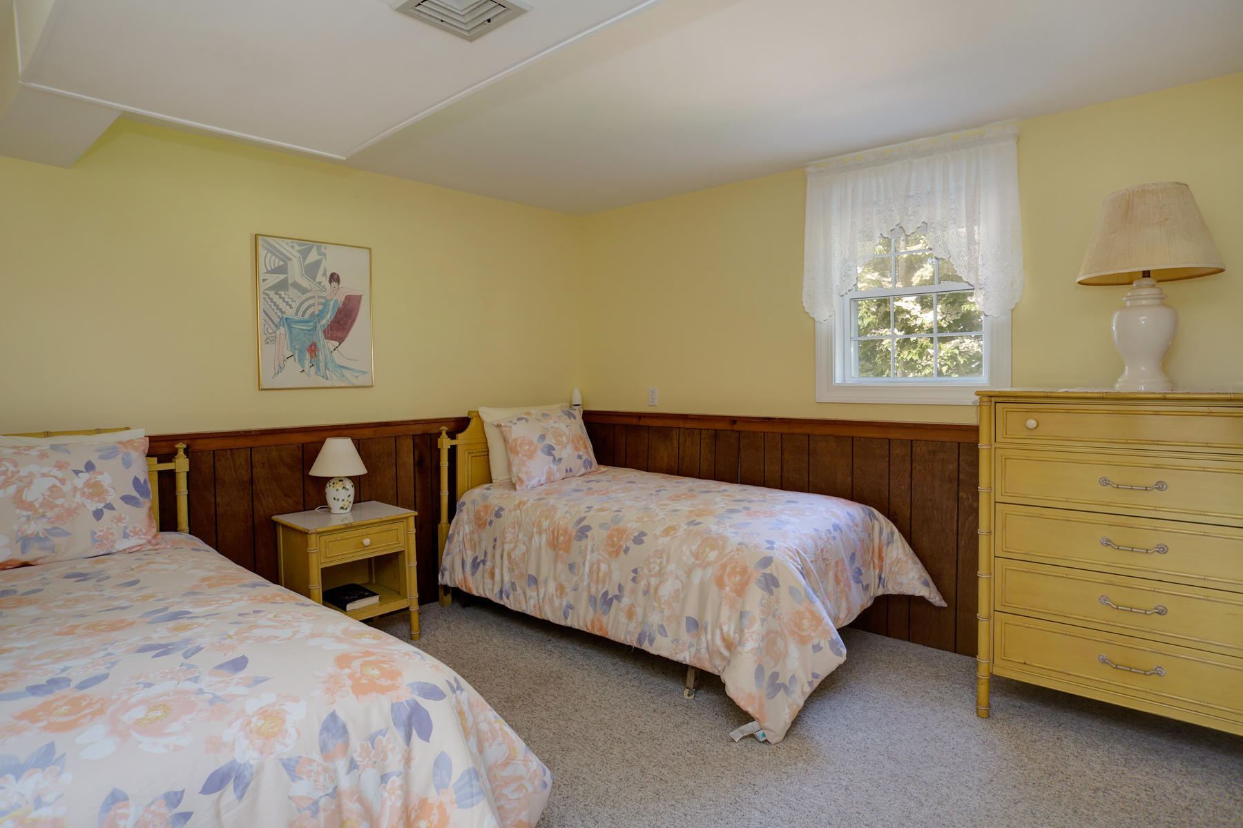 256 Monomoscoy Road Mashpee, MA 02649 - Photo 22 of 28 a bedroom with a bed and a night stand