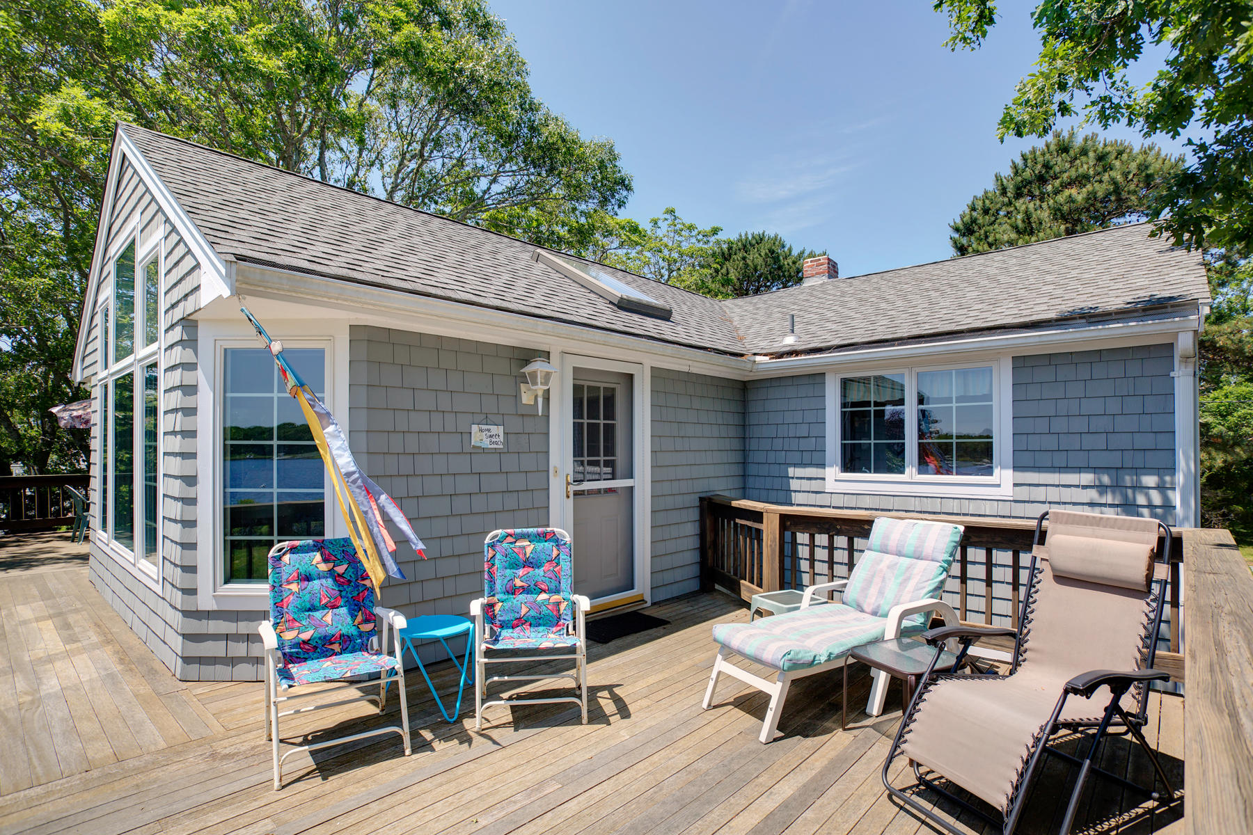 256 Monomoscoy Road Mashpee, MA 02649 - Photo 6 of 28 a view of backyard with outdoor seating and green space