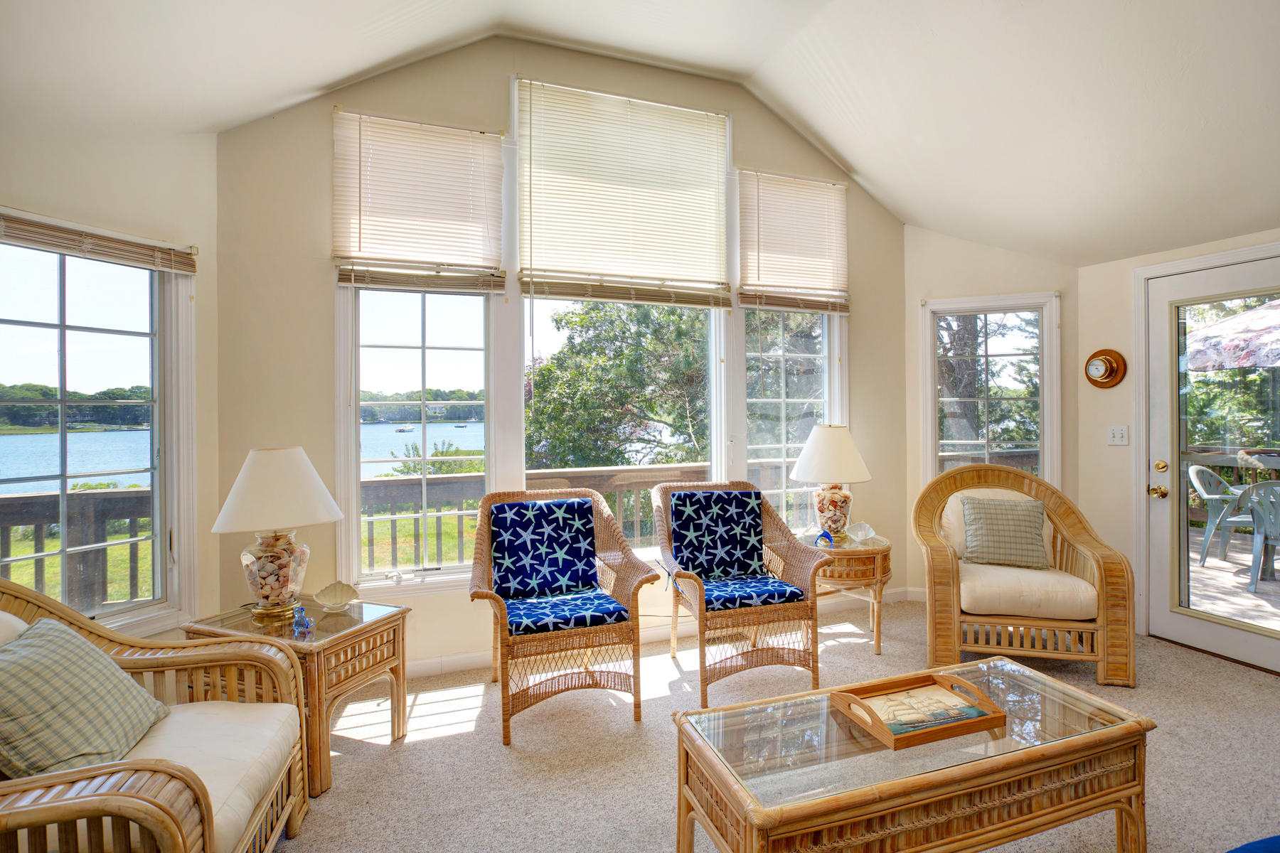 256 Monomoscoy Road Mashpee, MA 02649 - Photo 8 of 28 a living room with furniture and a large window