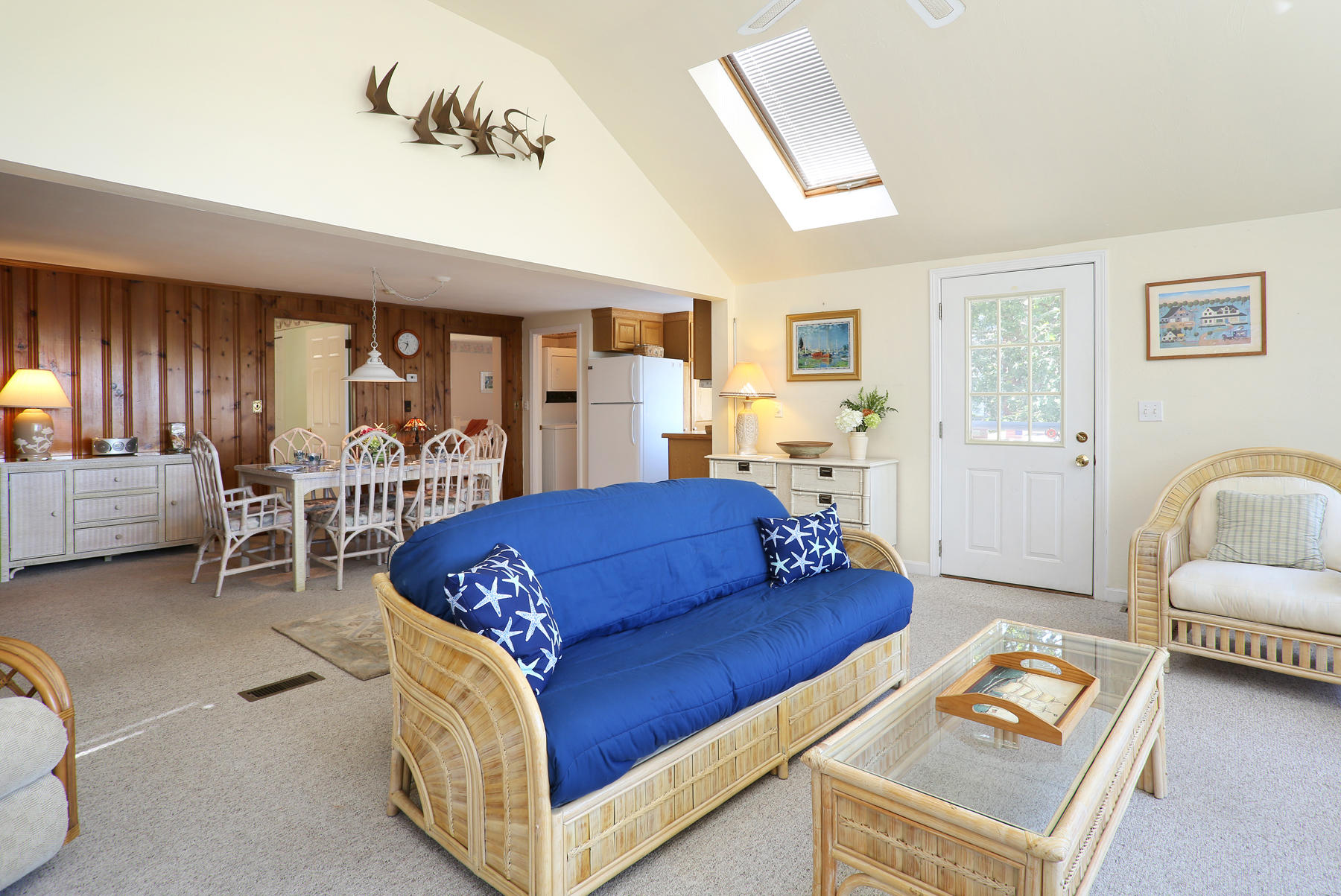 256 Monomoscoy Road Mashpee, MA 02649 - Photo 9 of 28 a living room with furniture and a table
