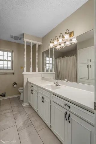 a spacious bathroom with a double vanity sink mirror and