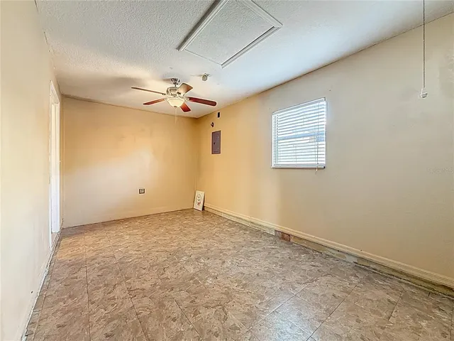 a bathroom with a granite countertop sink a toilet and shower