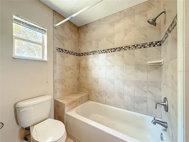 a view of a car in back of the house