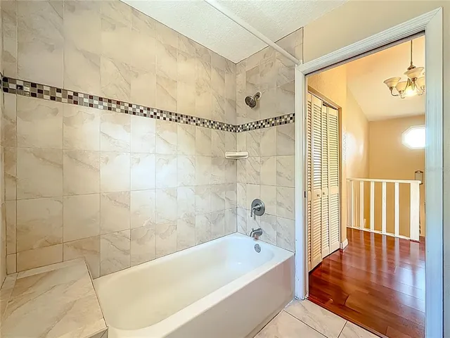 a view of a room with large windows and furniture