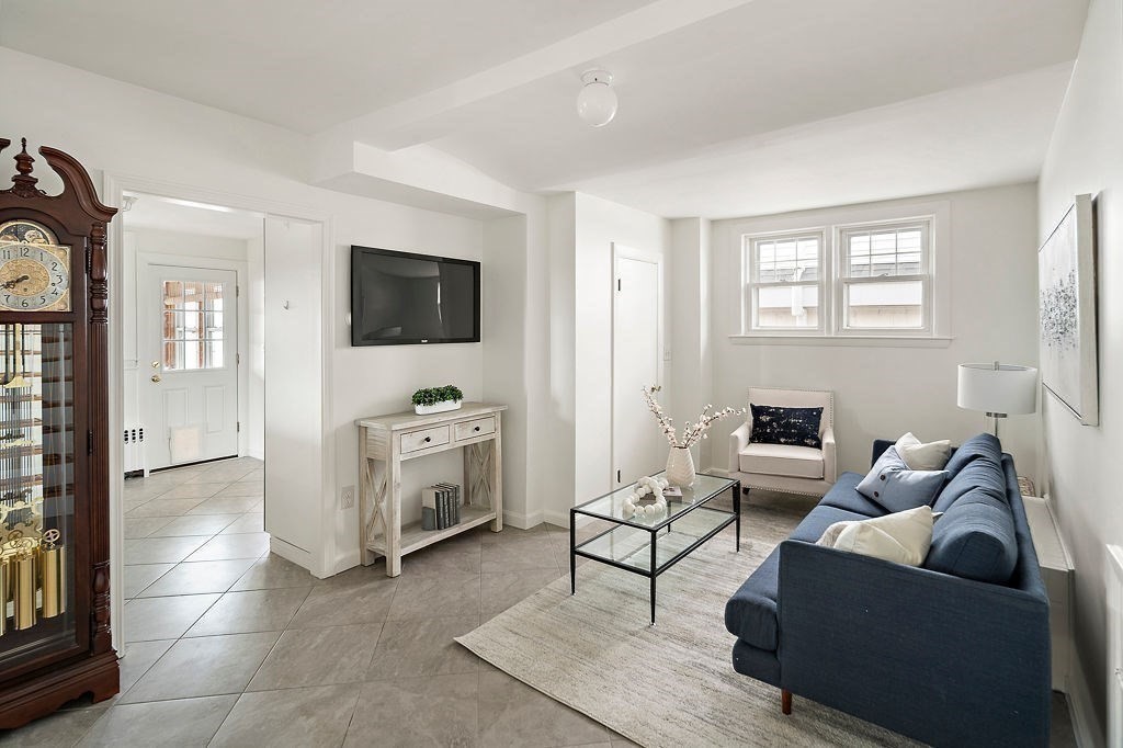 1 Spray Avenue Revere, MA 02151 - Photo 11 of 36 a living room with furniture and a flat screen tv