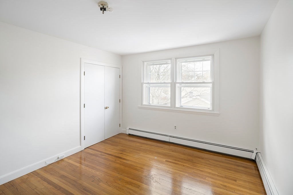 1 Spray Avenue Revere, MA 02151 - Photo 20 of 36 wooden floor in an empty room with a window