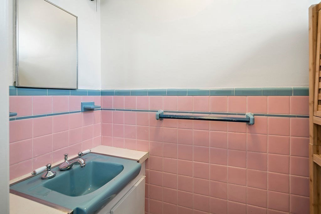 1 Spray Avenue Revere, MA 02151 - Photo 24 of 36 a bathroom with a sink a mirror and vanity