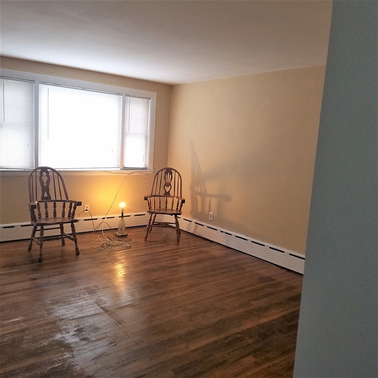 1 Spray Avenue Revere, MA 02151 - Photo 27 of 36 a view of a room with wooden floor and a window