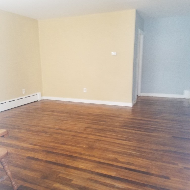 1 Spray Avenue Revere, MA 02151 - Photo 28 of 36 a view of an empty room with wooden floor