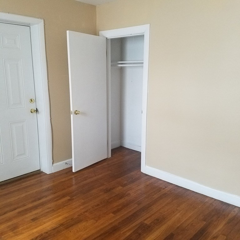 1 Spray Avenue Revere, MA 02151 - Photo 29 of 36 a view of an empty room with wooden floor and closet