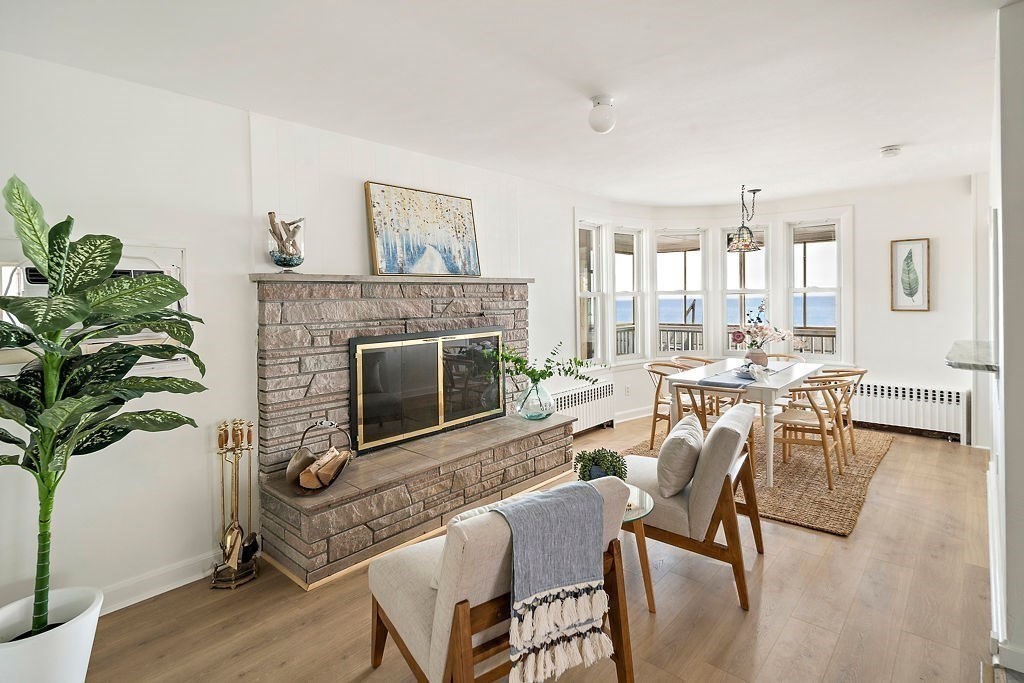 1 Spray Avenue Revere, MA 02151 - Photo 3 of 36 a living room with furniture a potted plant and a fireplace
