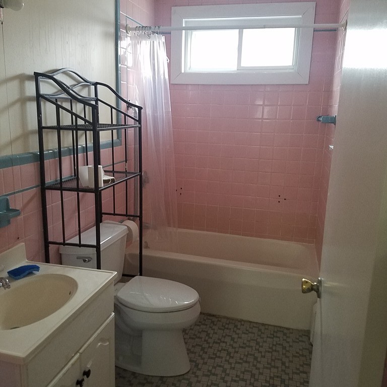 1 Spray Avenue Revere, MA 02151 - Photo 31 of 36 a bathroom with a toilet a sink and bathtub