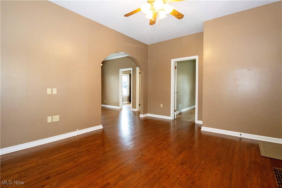 5699 Massillon Road Dalton, OH 44618 - Photo 13 of 24 Empty room featuring ceiling fan and dark hardwood / wood-style floors