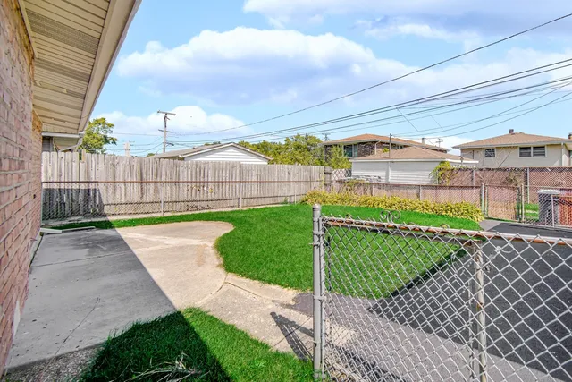 a view of a backyard with a garden