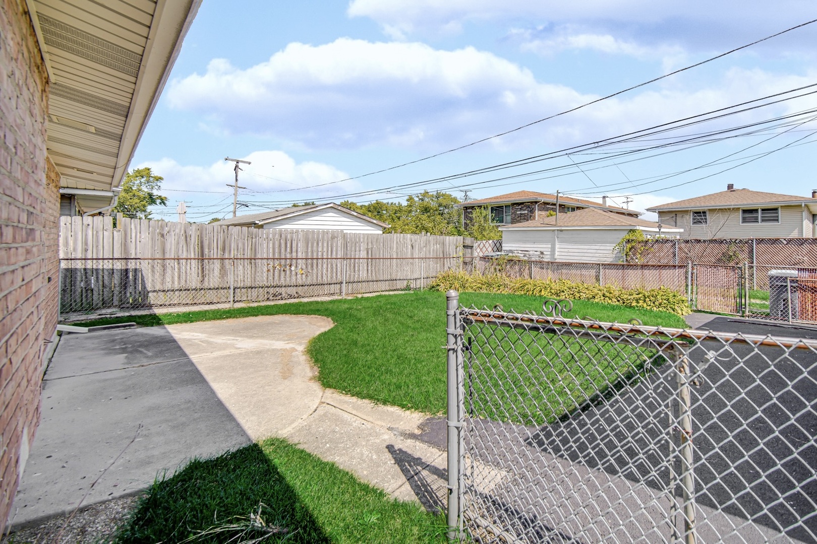 1455 Burnham Avenue Calumet City, IL 60409 - Photo 17 of 20 a view of a backyard with a garden