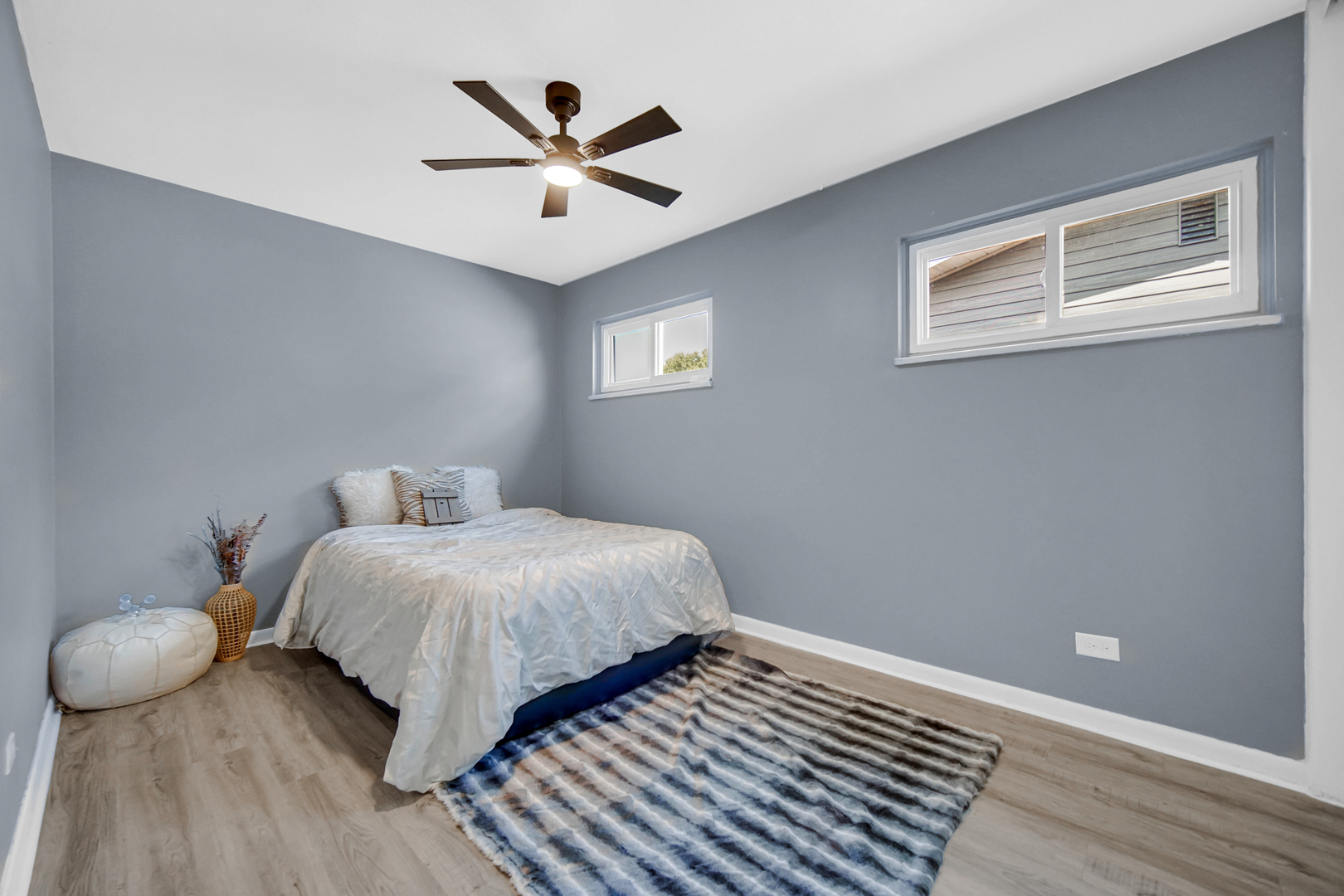 1455 Burnham Avenue Calumet City, IL 60409 - Photo 10 of 20 a bedroom with a bed and painting on the wall