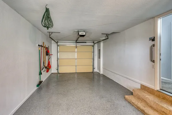 a view of a room with window and wooden floor