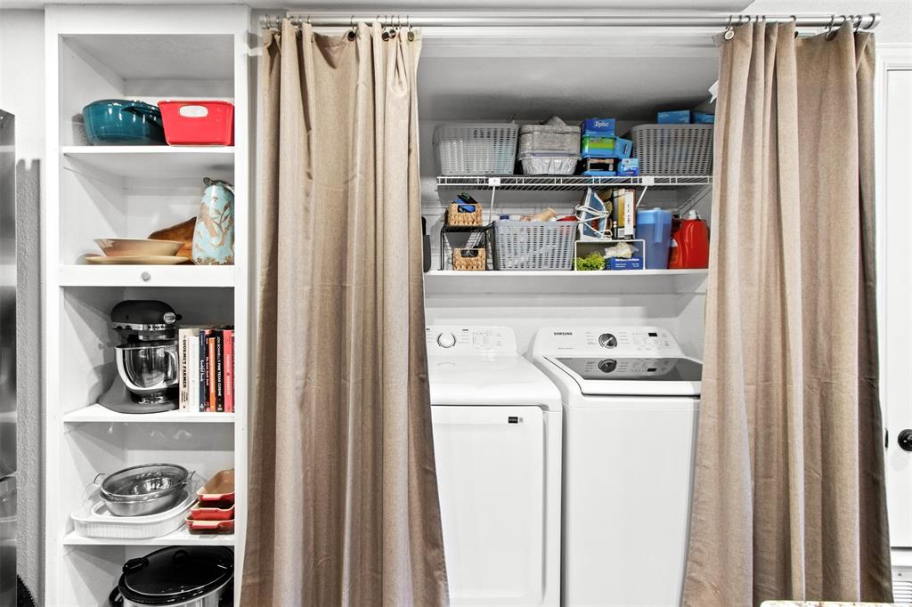 18040 Midway Road, Unit 103 Dallas, TX 75287 - Photo 9 of 37 The laundry room is in the kitchen offering full size washer and dryer hookups and shelves