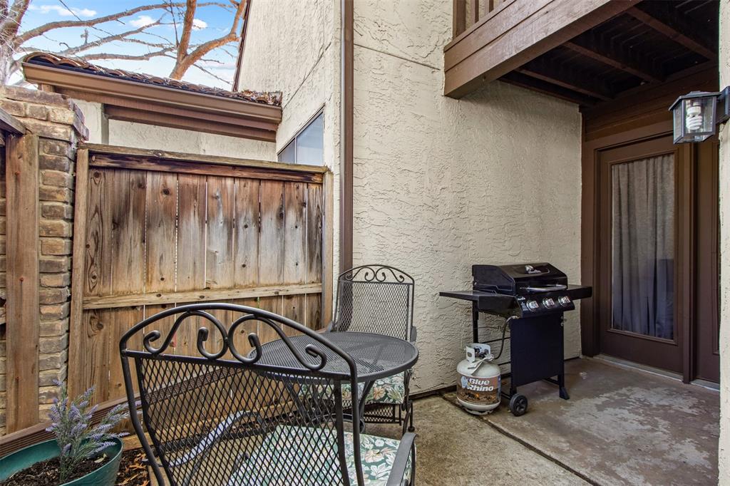 18040 Midway Road, Unit 103 Dallas, TX 75287 - Photo 23 of 37 Board-on-board fence for ultimate privacy and plenty of space for grilling and entertaining.