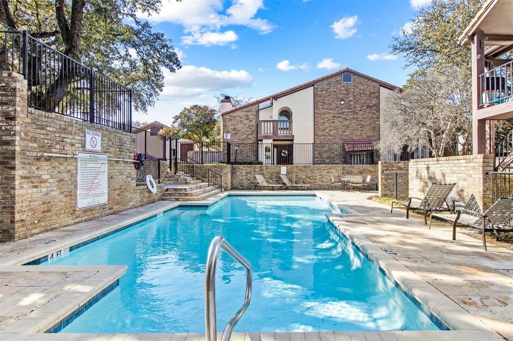 18040 Midway Road, Unit 103 Dallas, TX 75287 - Photo 28 of 38 a view of a swimming pool with a patio