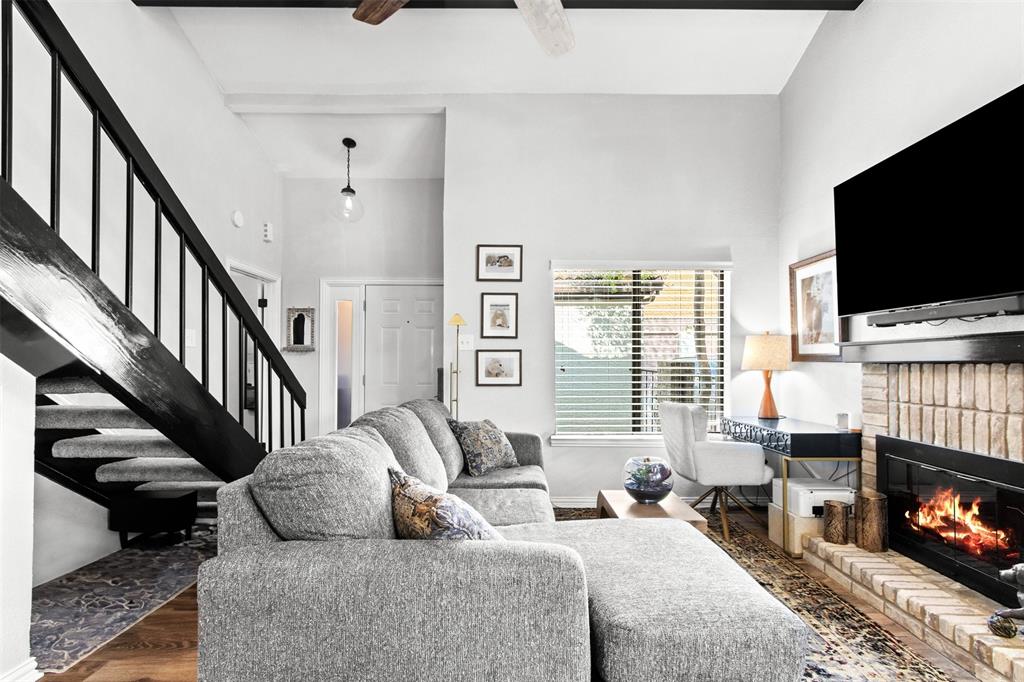 18040 Midway Road, Unit 103 Dallas, TX 75287 - Photo 36 of 37 a living room with furniture and a flat screen tv