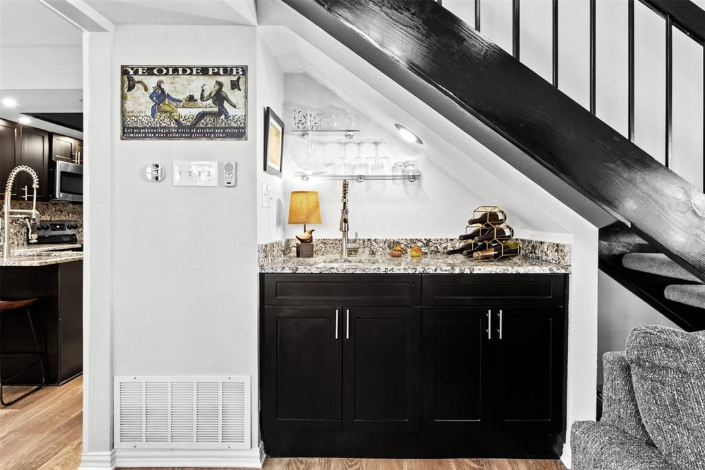 18040 Midway Road, Unit 103 Dallas, TX 75287 - Photo 2 of 37 a kitchen with a sink and cabinets