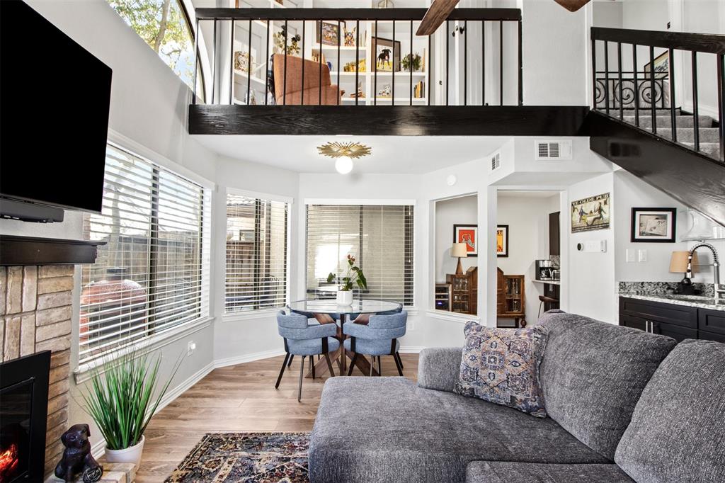 18040 Midway Road, Unit 103 Dallas, TX 75287 - Photo 38 of 38 a living room with furniture fireplace and flat screen tv