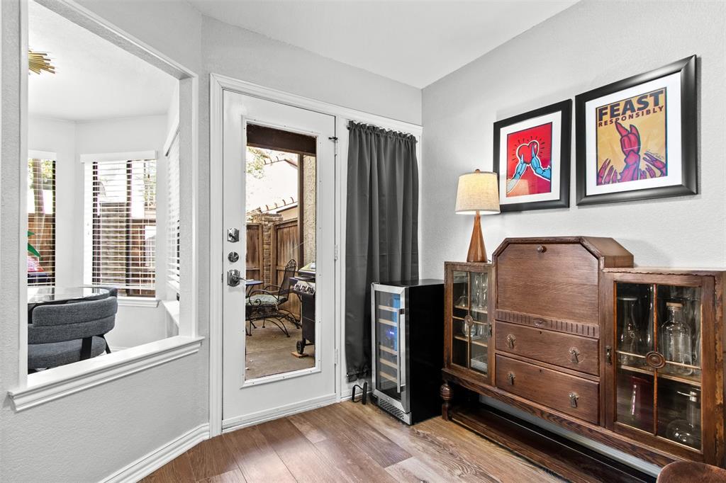 18040 Midway Road, Unit 103 Dallas, TX 75287 - Photo 5 of 38 a view of a hallway with wooden floor and windows