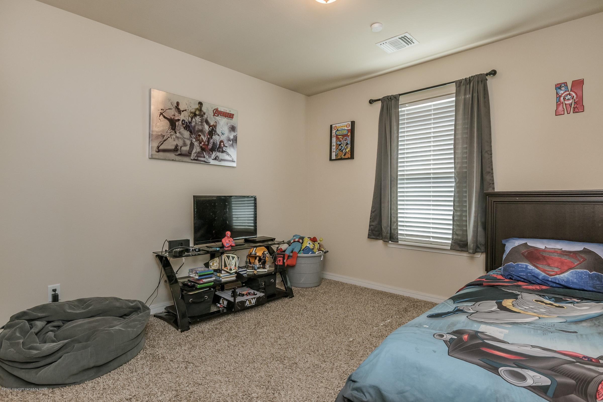 2808 Simkins Lane Amarillo, TX 79118 - Photo 11 of 20 a bedroom with a bed and a window