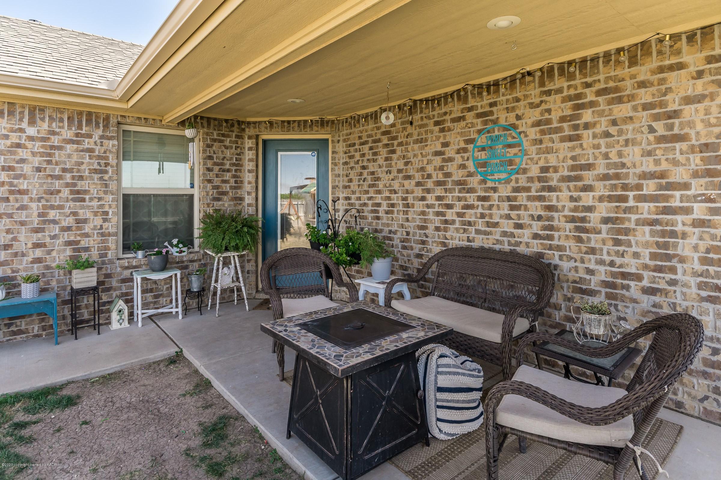 2808 Simkins Lane Amarillo, TX 79118 - Photo 15 of 20 a view of a patio with table and chairs and potted plants