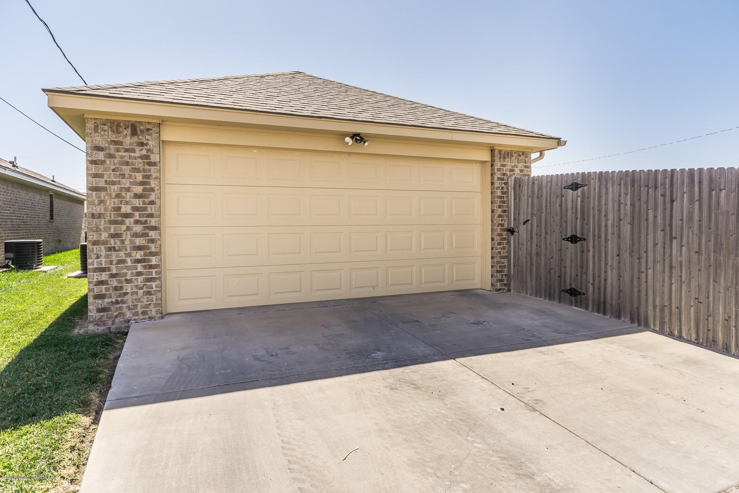 2808 Simkins Lane Amarillo, TX 79118 - Photo 18 of 20 a front view of a house with a garage
