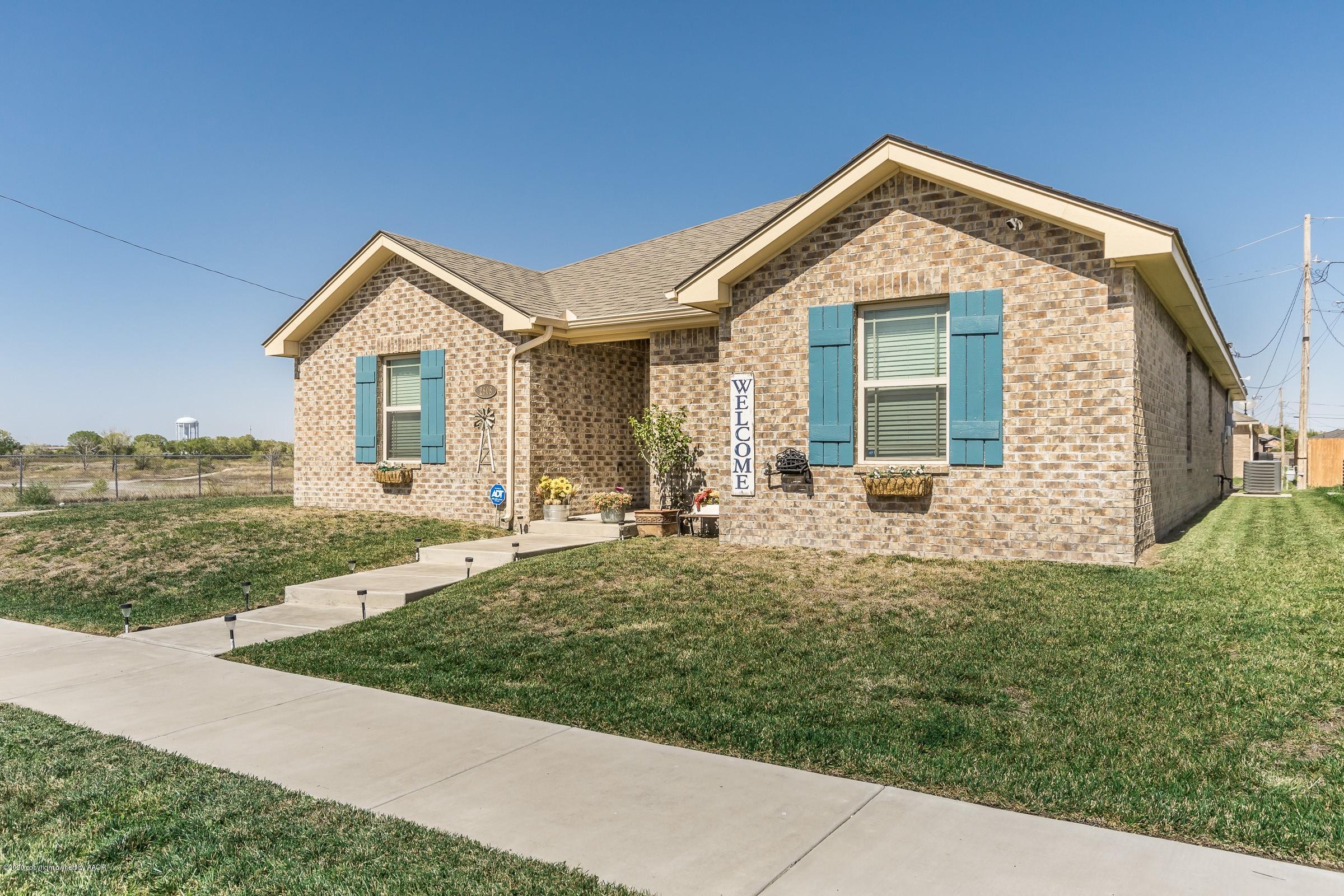 2808 Simkins Lane Amarillo, TX 79118 - Photo 20 of 20 a front view of a house with a yard
