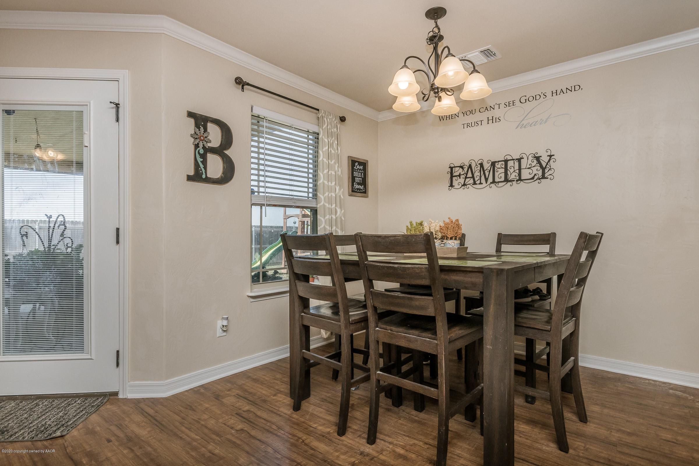 2808 Simkins Lane Amarillo, TX 79118 - Photo 7 of 20 a view of a dining room with furniture and chandelier