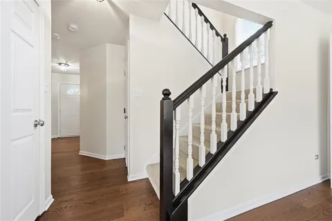 a view of an entryway with wooden floor