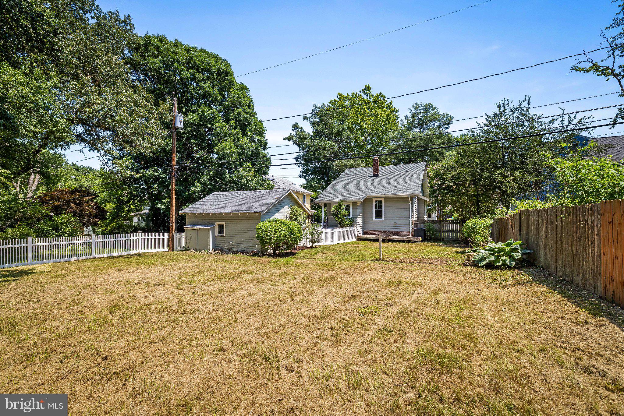 106 Sycamore Road Linthicum Heights, MD 21090 - Photo 51 of 51 a front view of a house with a yard and garage