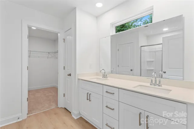 a bathroom with a granite countertop sink mirror and double
