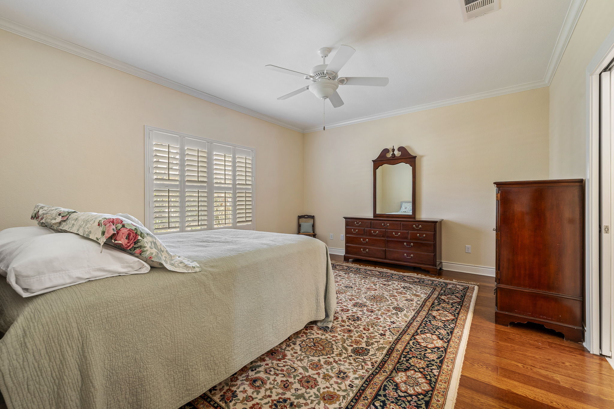 5201 Big Spring Street Georgetown, TX 78633 - Photo 13 of 26 Bedroom featuring wood finished floors, ornamental molding, and ceiling fan