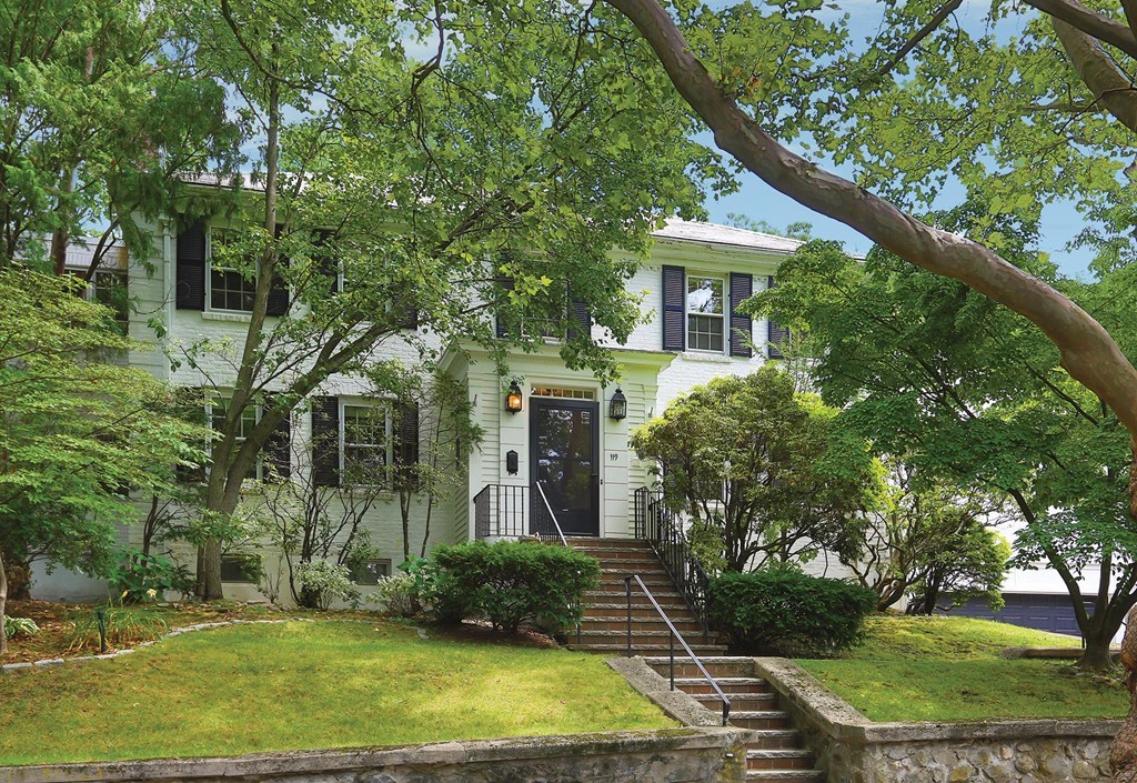 front view of a house with a yard