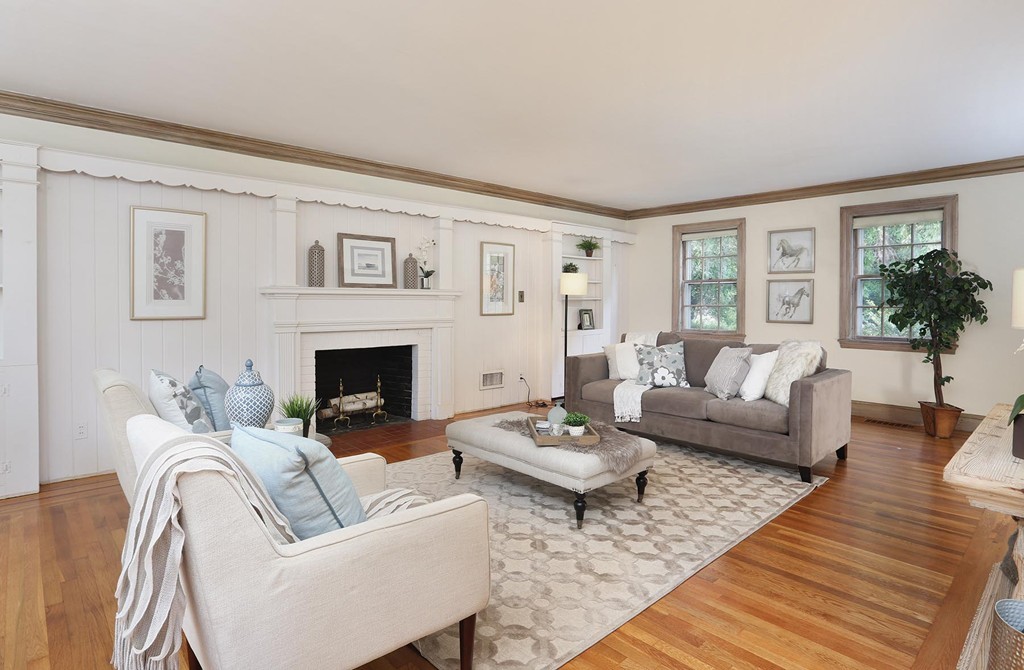 119 Walnut Hill Road Brookline, MA 02467 - Photo 2 of 12 a living room with furniture and a fireplace