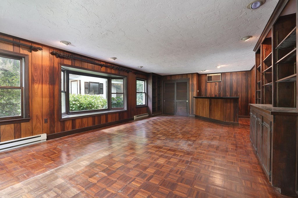 119 Walnut Hill Road Brookline, MA 02467 - Photo 6 of 12 a view of an empty room with a window and storage