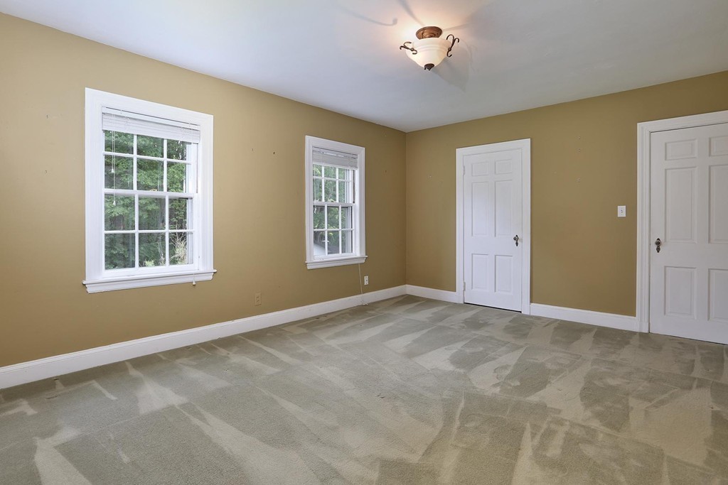 119 Walnut Hill Road Brookline, MA 02467 - Photo 8 of 12 a view of an empty room with a window
