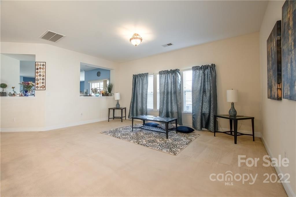 6809 Evanton Loch Road Charlotte, NC 28278 - Photo 11 of 30 a view of a room with gym equipment and windows
