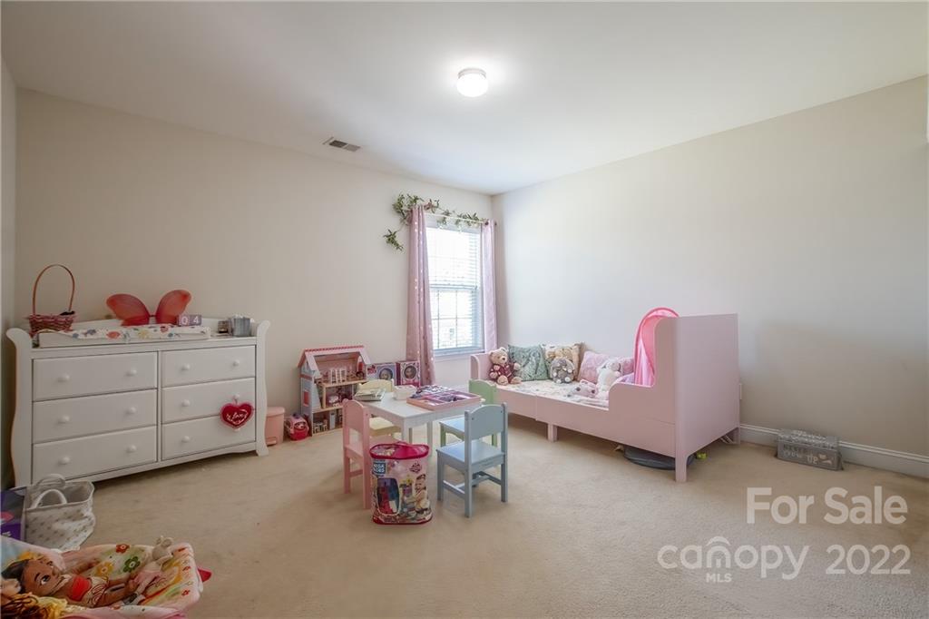6809 Evanton Loch Road Charlotte, NC 28278 - Photo 17 of 30 a bedroom with furniture and a window