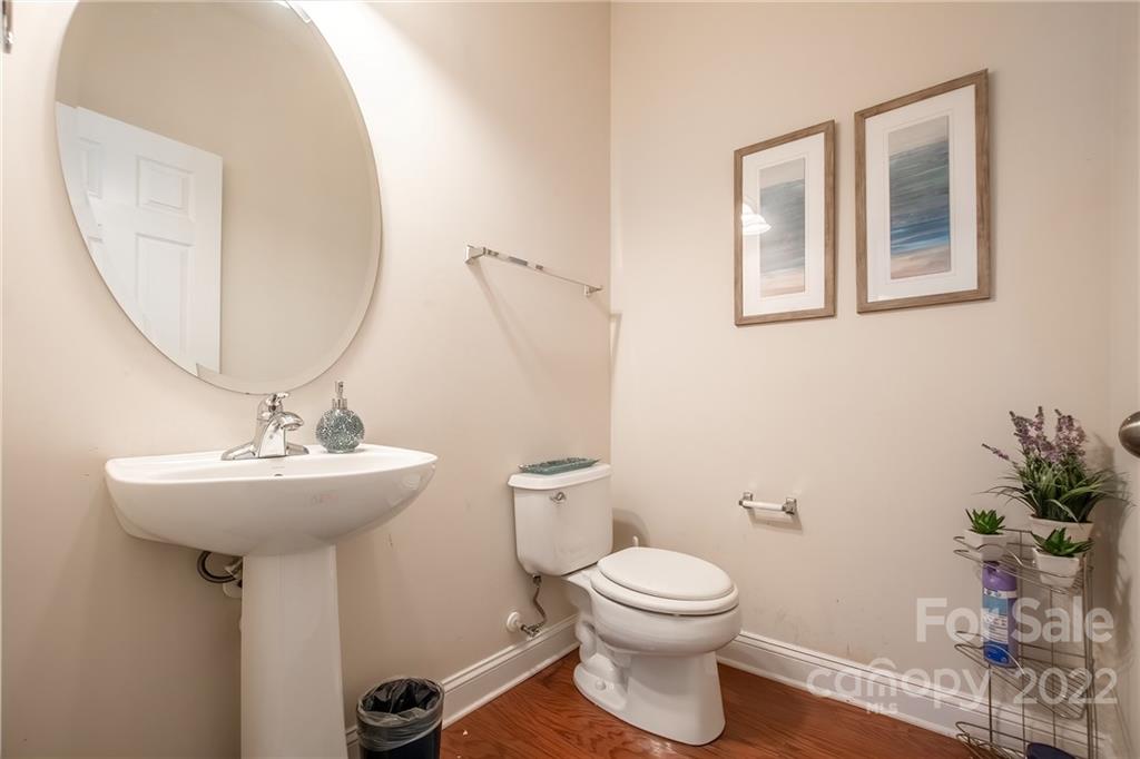 6809 Evanton Loch Road Charlotte, NC 28278 - Photo 22 of 30 a bathroom with a sink toilet and a mirror