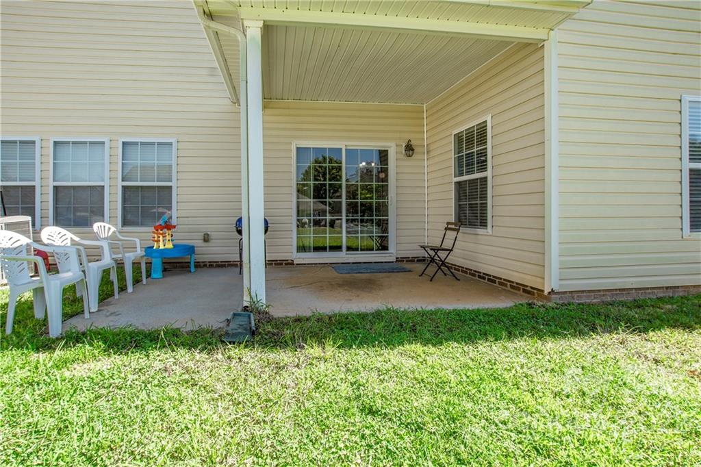 6809 Evanton Loch Road Charlotte, NC 28278 - Photo 24 of 30 a view of backyard of house with outdoor seating and green space