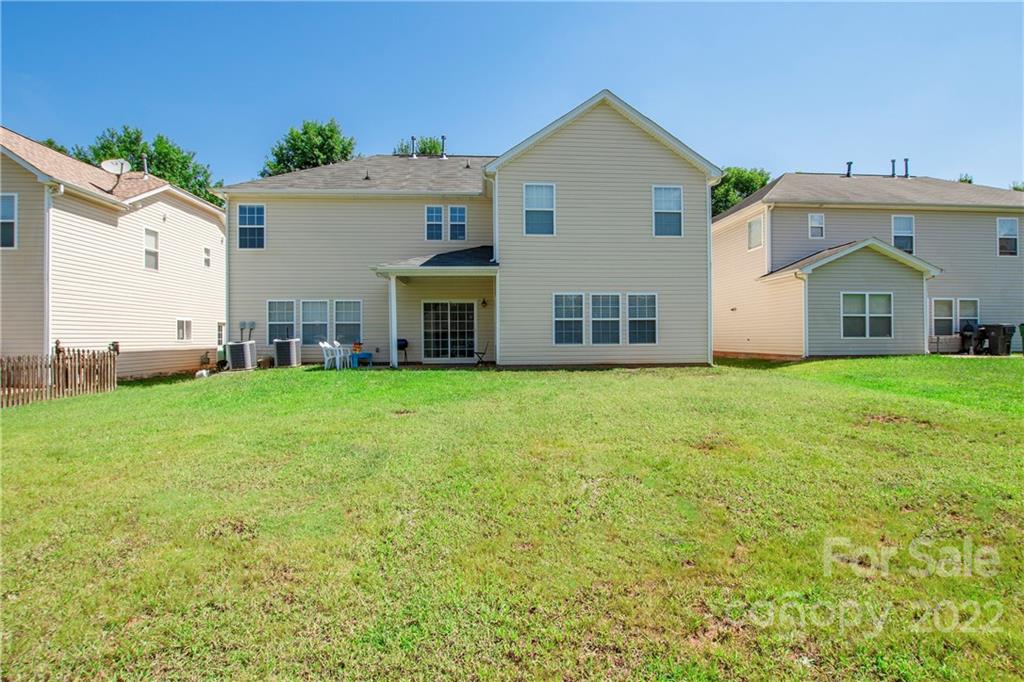 6809 Evanton Loch Road Charlotte, NC 28278 - Photo 25 of 30 a view of a house with a yard and sitting area