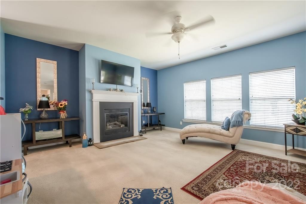 6809 Evanton Loch Road Charlotte, NC 28278 - Photo 3 of 30 a living room with furniture and a fireplace