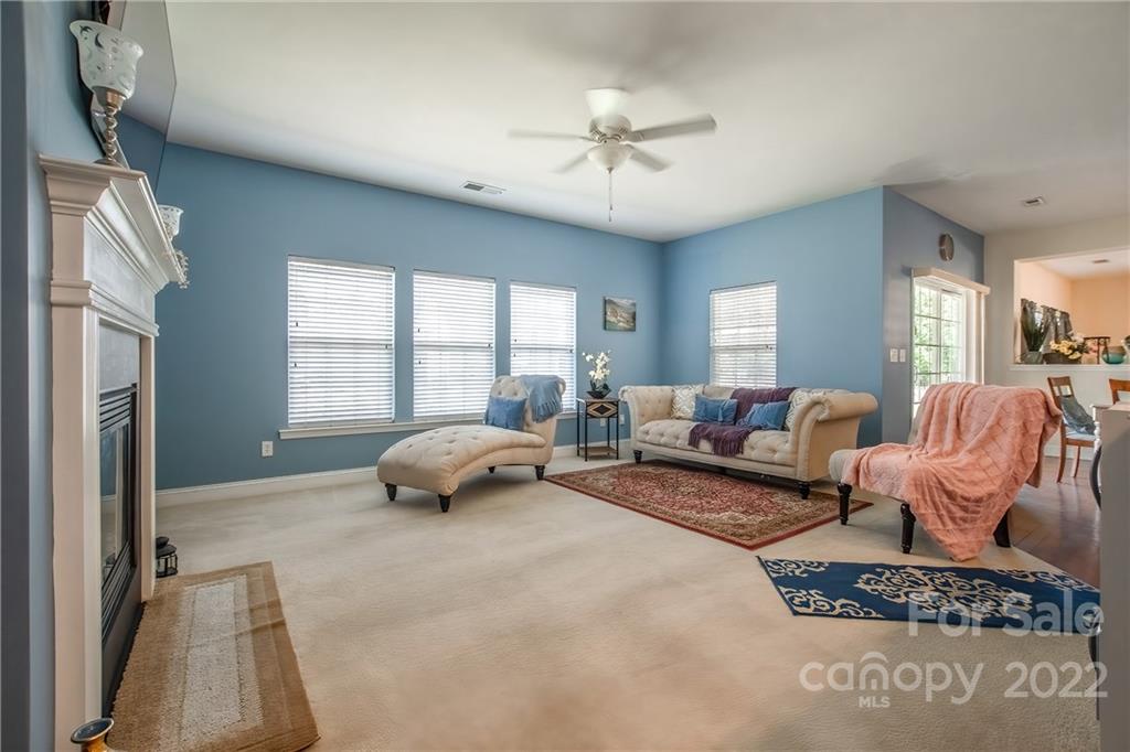 6809 Evanton Loch Road Charlotte, NC 28278 - Photo 4 of 30 a living room with furniture and a large window